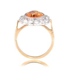 A bold citrine ring that features a halo of old cut diamonds following a floral motif. The top is set with silver and the ring is 18k yellow gold. Yellow Oval Topaz Ring With Halo Setting, Citrine Ring, Yellow Sapphire, Antique Rings, Floral Motif, Citrine, Halo, Antique Silver, Ring