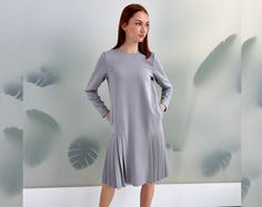 Silver Grey Women Dress, Shirt Dress, Plus Size Dress Loose fit dress with pleats in silver grey color Long sleeves, round neckline Zipper closure on the back Length: ~ 100 cm The model is wearing -Silver- color ➤ Sizing My Size Guide in FAQ section below will help you define the perfect size match.  The item can also be made according to your measurements - just message them to me.  ➤ Delivery Your item is made-to-order and will be ready within 2-7 days.  Average delivery times: > Europe: up to Gray Pleated Dress For Spring, Long Sleeve Dress Plus Size, Fox Print Dress, Pink Tunic Dress, Midi Dress Long Sleeve, Loose Midi Dress, Dress Minimalist, Black Pleated Dress, Clothing Winter