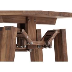 a close up of a wooden table with wheels on it