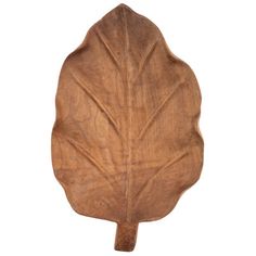 a wooden leaf shaped object on a white background