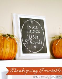 two pumpkins sitting on top of a mantle next to a chalkboard with the words in all things give thanks