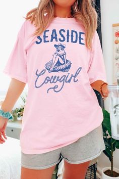 SEASIDE COWGIRL WESTERN GRAPHIC T-SHIRTPREMIUM COTTONUNISEX SIZINGCLASSIC FITMade In: USAFabric Contents: 100% Cotton Cute Pink Tops With Front Print, Cute Soft-washed Pink T-shirt, Cute Soft-washed Pink Top, Cute Pink Soft-washed Tops, Pink Cotton Tops With Front Print, Pink Cotton Top With Front Print, Pink Cotton Shirt With Front Print, Western Graphic Tees, Summer Clearance