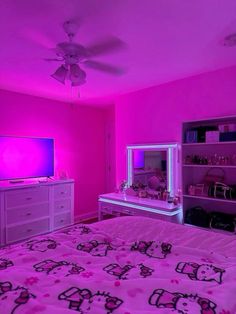 a bedroom with pink walls and hello kitty bedding in the middle is lit up by purple lighting