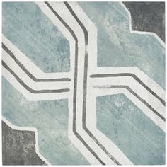 a blue and gray rug with lines on it