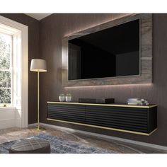 a large flat screen tv mounted to the side of a wall in a living room