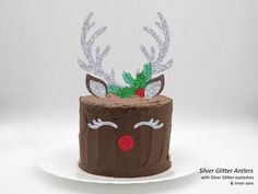 a chocolate cake with reindeer antlers on top