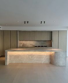 a large kitchen with an island counter top