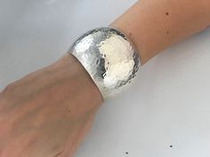 "Vintage Taxco Mexico 925 Silver Extra Wide Hammered Dome Cuff. High quality 925 silver with a versatile design to suit many styles. Quality item weighing 40 grams that is in good vintage condition ready to wear. Markings: 925 Mexico, TA-78 Measurements: Approx 6 1/4\" Total Inside Circumference including the wrist opening, 2 1/8\" inside diameter across, 1 1/8' wrist opening, Total Weight: 40 grams Condition: Good Vintage condition, ready to wear with standard signs of wear for a vintage item s Silver Hammered Cuff Bracelet, Formal Hammered Silver Cuff Bracelet, Silver Hammered Cuff Bangle, Silver Hammered Cuff Bracelet For Formal Occasions, Formal Silver Hammered Cuff Bracelet, Geometric Bangle, Red Topaz, Valley City, Hammered Sterling Silver