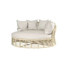 a round wicker couch with white pillows on the top and bottom, in front of a white background