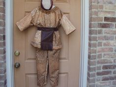 a child's costume is hanging on the front door