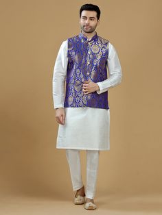 A gold zari brocade vest to pair with any kurta with statement button closures at the front. Occasion: Style this vest with pajama pants and a kurta for a welcome dinner or sangeet night, or style it with a any dress shirt and trousers for a sleek Indian wedding reception look! WASH CARE INSTRUCTIONS - Please Dry clean only. Slight color variation is possible due to digital photography. **Kurta & Pajama not included Sleeveless Nehru Jacket With Zari Work, Sleeveless Nehru Jacket With Zari Work For Transitional Season, Sleeveless Bandhgala For Eid, Traditional Sleeveless Kurta With Zari Work, Designer Sleeveless Kurta For Transitional Season, Sleeveless Bandhgala For Festivals, Sleeveless Nehru Jacket For Diwali, Designer Sleeveless Kurta For Eid, Brocade Nehru Jacket For Diwali Designer Wear