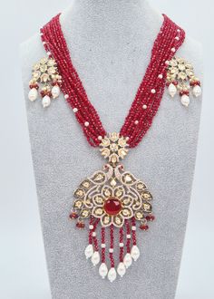 "Tyaani Kundan Double Peacock Mala Necklace Set/Maroon Long Necklace Set/Indian Jewelry/Rani Haar/Bridal Necklace Set/Pakistani Jewelry Enhance your special event with the mesmerizing Maroon necklace set that showcases Kundan embellishments and a mala made of hydro beads. Make sure to grab this exquisite jewelry piece before it's too late! Necklace Length: 16\" Neckline has an adjustable doori. Earring Lenght: 2\" Push-Back closure Weight : 12 gms each. Dual-tone finish on high-quality brass as a base metal. Availability: In-Stock. *Color may vary slightly due to light condition & photography. Jewelry Care:  Keep away from moisture. Allow perfumes and lotion to dry before wearing. Store in jewelry pouch. Clean only with soft lint-free cloth.  At Sparkling Trendz, we offer a wide range of j Festive Red Peacock Design Necklace, Red Kundan Jewelry With Peacock Design, Festival Necklaces With Stone Work, Festive Kundan Beaded Necklaces With Intricate Design, Heavy Beaded Bollywood Necklace For Festive Occasions, Heavy Beaded Necklaces For Diwali Festivities, Heavy Bollywood Beaded Necklace For Festive Occasions, Festive Stone Work Necklace For Eid, Festive Chandbali Kundan Necklace With Peacock Design