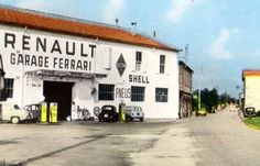 an old black and white photo of cars parked in front of a garage with the words renault garage ferrari on it