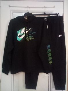 NWT NIKE SIZE XL Black/Turquoise Sweat suit EXCELLENT CONDITION "Unisex" The measurements are appropriate 54" across the chest & 29" from the shoulder to the hem. Pants: XXl (38") Waist & 29" inseam. Please ask any questions before making your purchase, Cleaning Closets: NO RETURNS Nike Sweat Sets Women, Nike Sets For Men, Nike Sets, Sweat Sets, Hem Pants, Sweat Suit, Nike Sweats, Black Turquoise, Cleaning Closet