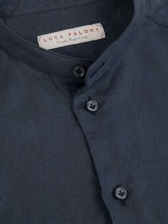 The Versilia linen shirt features a band polo collar, for a more casual and effortless summer look. The fit of this design is more relaxed compared to our signature classic shirts. Crafted in Bergamo, in Northern Italy, by skilled artisans with the finest Italian pure linen and mother of pearl buttons. Learn about the properties of linen and how to wear it, and discover what makes our linen unique. Lapel Collar Linen Shirt With Pockets, Unstructured Linen Camp Shirt With Spread Collar, Classic Collared Linen Camp Shirt, Luxury Linen Camp Collar Shirt, Linen Button-up Shirt With Welt Pockets, Band Collar, Summer Staples, Fine Linen, Polo Collar