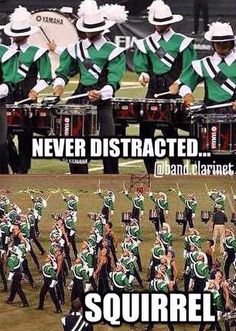 the marching band is in green and white uniforms, with words that read never distracted