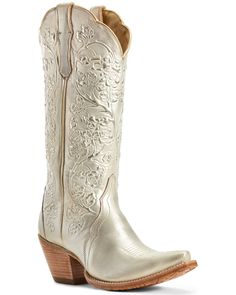 a pair of white cowboy boots on a white background