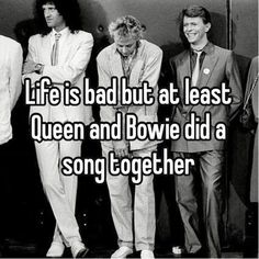 some guys in suits and ties standing together with the words life is bad but at least queen and bovie did a song together