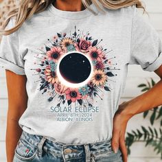 Solar Eclipse Shirt, 2024 Solar Eclipse, Gildan Softstyle Ash Gray Unisex Fit Gildan Softstyle Unisex Fit DTF About the print:  The design on this tee is DTF "direct to film" meaning the design is printed on film with special ink then cured and pressed onto the garment. The design will sit on top of the fabric, you will be able to feel the design but the design has a lot softer feel than vinyl but still with very vibrant colors. All materials used are high quality, professional grade. Summer Crew Neck T-shirt With Printing, Printed Short Sleeve T-shirt For Summer, Spring Shirt With Front Print In Relaxed Fit, Trendy Printed Tops, Spring Shirt With Front Print And Relaxed Fit, Summer Crew Neck Top With Printing, Spring Shirt With Front Print And Crew Neck, Trendy Crew Neck Top With Printing, Spring Crew Neck Shirt With Front Print