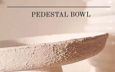 a close up of a bowl on a table with the words pedestal bowl above it