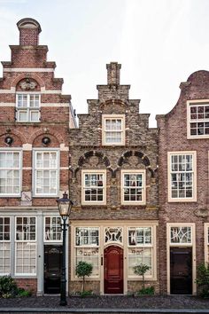 an old brick building with many windows and doors