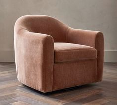 a brown chair sitting on top of a wooden floor