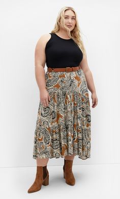 Embrace your inner free spirit with the Misha Print Skirt. Featuring an elasticated back waistband for a figure-hugging fit and a relaxed style to skim your curves, the tiered maxi skirt instantly injects feminine boho vibes everywhere you go. Key Features Include: - Elasticated back waistband - Relaxed fit - Pull on style - Tiered skirt - Hi-lo hemline Pair with sandals and a tucked-in top for lunch with the girls. | Plus Size Misha Print Skirt in Caramel Paisley, Size 12 | City Chic Tiered Maxi Skirt, Lingerie Dress, Date Night Dresses, Plus Size Skirts, Print Skirt, Casual Summer Dresses, Fit N Flare Dress, Tiered Skirt, City Chic