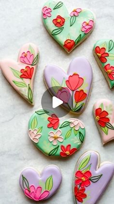 heart shaped cookies with flowers painted on them