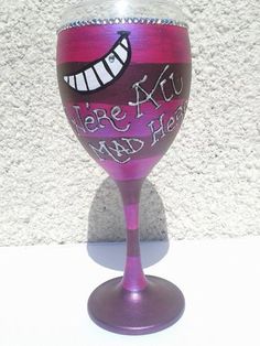 there is a wine glass that has been painted