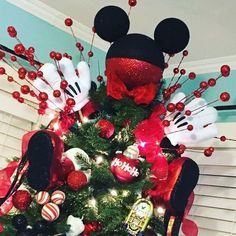 a christmas tree decorated with mickey mouse decorations