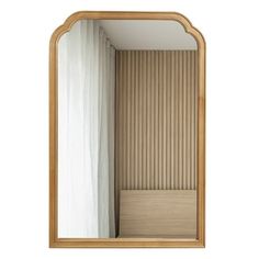 a mirror that is sitting on top of a shelf in front of a curtained wall