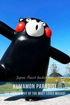 a large inflatable black bear with red eyes on it's face and arms