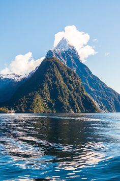 a large mountain towering over a body of water