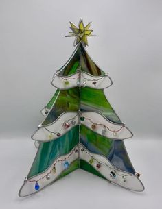 a stained glass christmas tree on a white background