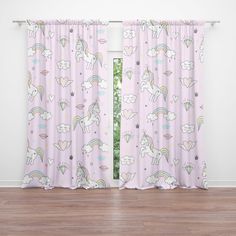 pink curtains with unicorns and rainbows on them in front of a white wall