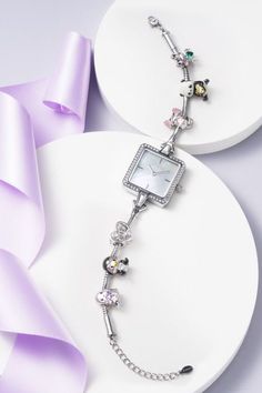 A pave-embellished bezel and white square mother-of-pearl dial make the whole simple but elegant. You could match charms to create a different style, whether it's for everyday wear or for banquets. An absolute eye-catcher! White Square, Square Watch, Exclusive Designs, Custom Jewelry, The Whole, Different Styles, Mother Of Pearl, Everyday Wear, Charm Bracelet