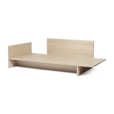 a wooden shelf sitting on top of a white wall