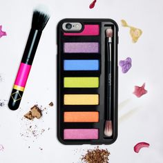 an iphone case with makeup and brushes on it