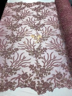 pink and gold lace fabric with sequins