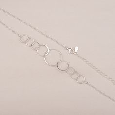 "This delicate 90th birthday necklace features nine lovely interlocking circles, hanging from the delicate 925 sterling silver chain. Each sterling silver necklace in this collection comes with a memorable quote printed on a wish card. It makes a beautiful and thoughtful 90th birthday gift for women. The message shown reads: Header: Happy 90th Birthday! Body: One Ring for One Fabulous Decade Here's to a happy 90 years, and cheers to 90 and more ✿Materials 925 Sterling Silver ✿ Product - Size Pen Round Necklace With Lobster Clasp For Birthday, Elegant Round Jewelry For Birthday, Elegant Jewelry For Birthday, Elegant Round Jewelry For Birthdays, Elegant Nickel-free Jewelry For Birthday, Elegant Hypoallergenic Necklaces For Birthday, Elegant Nickel Free Necklaces For Birthday Gift, Nickel-free Elegant Necklace For Birthday Gift, Elegant Nickel-free Necklaces For Birthday Gift