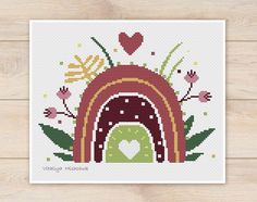 a cross stitch pattern with an image of a dog house and flowers on the outside