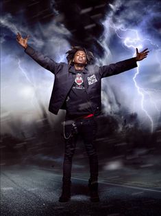 a man standing in the middle of a street with his arms out and lightning behind him