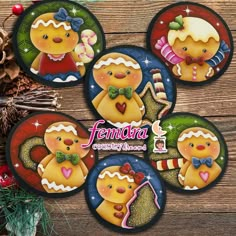 four christmas gingerbreads with bow ties on them are sitting next to pine cones