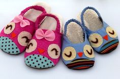 three pairs of baby shoes with owls on them