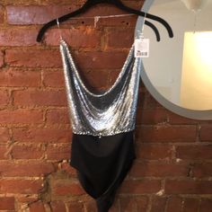 This Top Is A Super Sexy Backless Body Suit. It’s Shiny Sequin/Metal And Is Perfect For New Years Or The Club. Nwt Never Worn Backless Evening Bodysuit With Built-in Bra, Chic Bodysuit With Built-in Bra For Night Out, Chic Bodysuit With Built-in Bra For Evening, Glamorous Bodysuit For Evening Party Season, Elegant Bodysuit For Night Out Party, Elegant Bodysuit For Night Out And Party Season, Elegant Evening Bodysuit For Party Season, Glamorous Evening Bodysuit, Chic Sequined Bodysuit For Evening