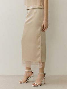 Soft and drapery, this H-line skirt features unique layered silhouette. deep slit detail at side and back adds to the voluminous, fluid design.  - Sheer inner panel and satin outer panels layered- Straight silhouette in midi length- Tucked detail at waist- Back zip fastenings- Luxurious, feminine mood Straight Long Skirt, Organza Skirt, Fluid Design, Office Attire, Champagne Gold, Long Skirt, Midi Length, Midi Skirt, Satin