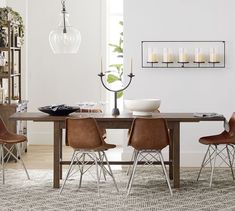 a dining room table with chairs around it