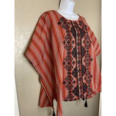 Andree By Unit Sz M Embroidered Red And Black Poncho Top With Tassels Euc. Purchased And Never Worn Smoke Free Pet Friendly Home 9 Red Bohemian Poncho For Festival, Traditional Top With Kimono Sleeves, Red Bohemian Poncho With Fringe, Red Floral Embroidered Kaftan For Festival, Red Folk Style Poncho For Festival, Folk Style Poncho With Floral Embroidery, Red Cape Poncho For Festival, Red Bohemian Kaftan With Floral Embroidery, Embroidered Red Blouse For Vacation