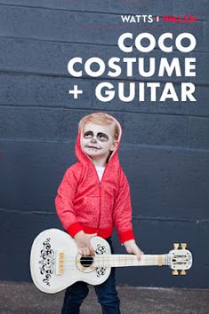 a little boy dressed up as a skeleton with a guitar in his hand and the words coco costume + guitar below him