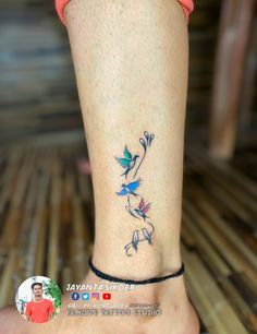 a woman's foot with a tattoo on the side of her leg and an image of a bird sitting on top of it